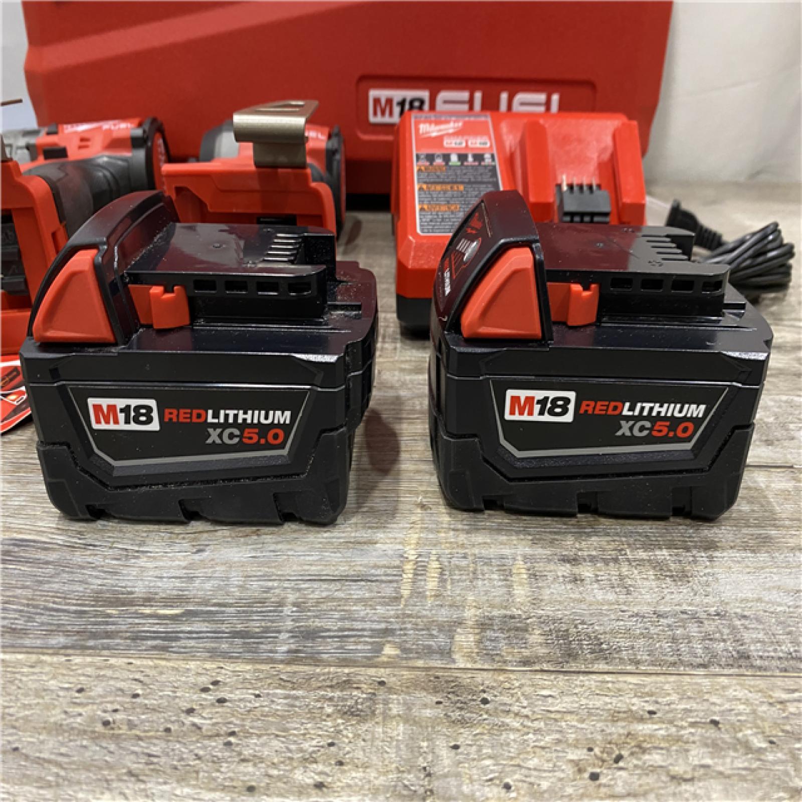 AS-IS Milwaukee FUEL 18V Lithium-Ion Brushless Cordless Hammer Drill and Impact Driver Combo Kit