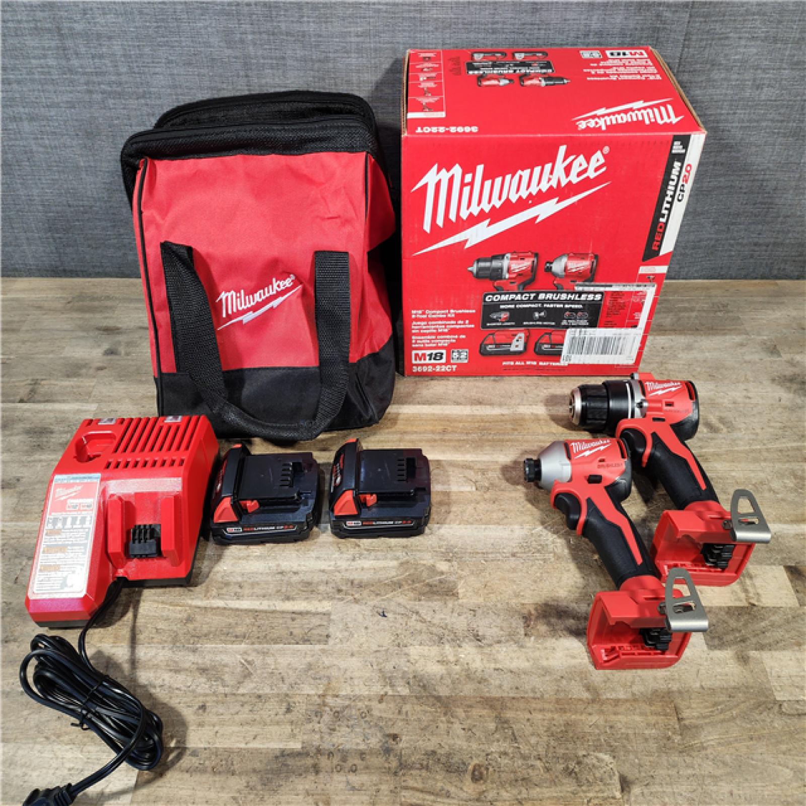 HOUSTON LOCATION - AS-IS Milwaukee M18 18V Lithium-Ion Brushless Cordless Compact Drill/Impact Combo Kit (2-Tool) W/(2) 2.0 Ah Batteries  Charger & Bag