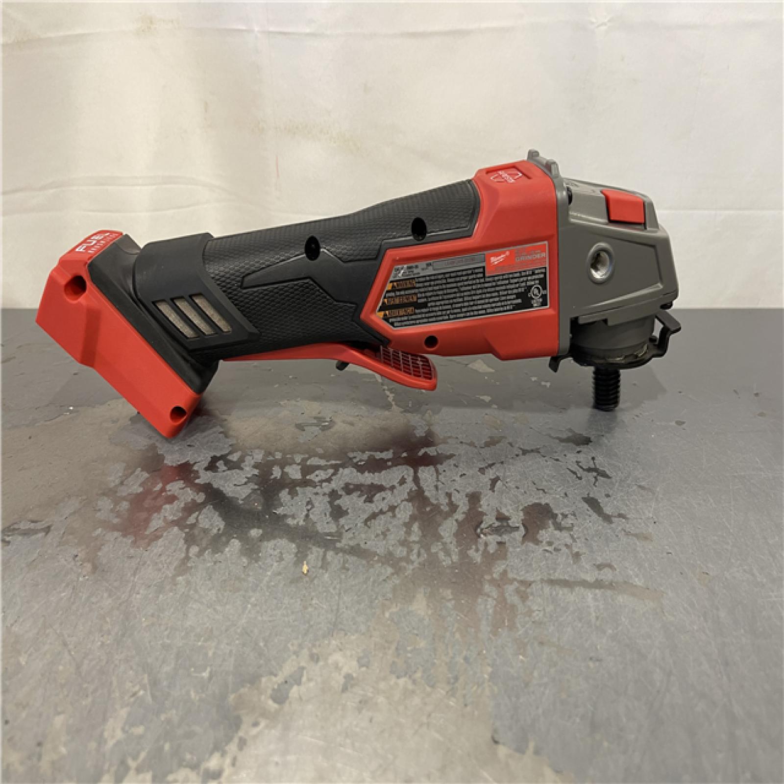 AS-IS - Milwaukee M18 FUEL 18V Lithium-Ion Brushless Cordless 4-1/2 in./5 in. Grinder w/Paddle Switch