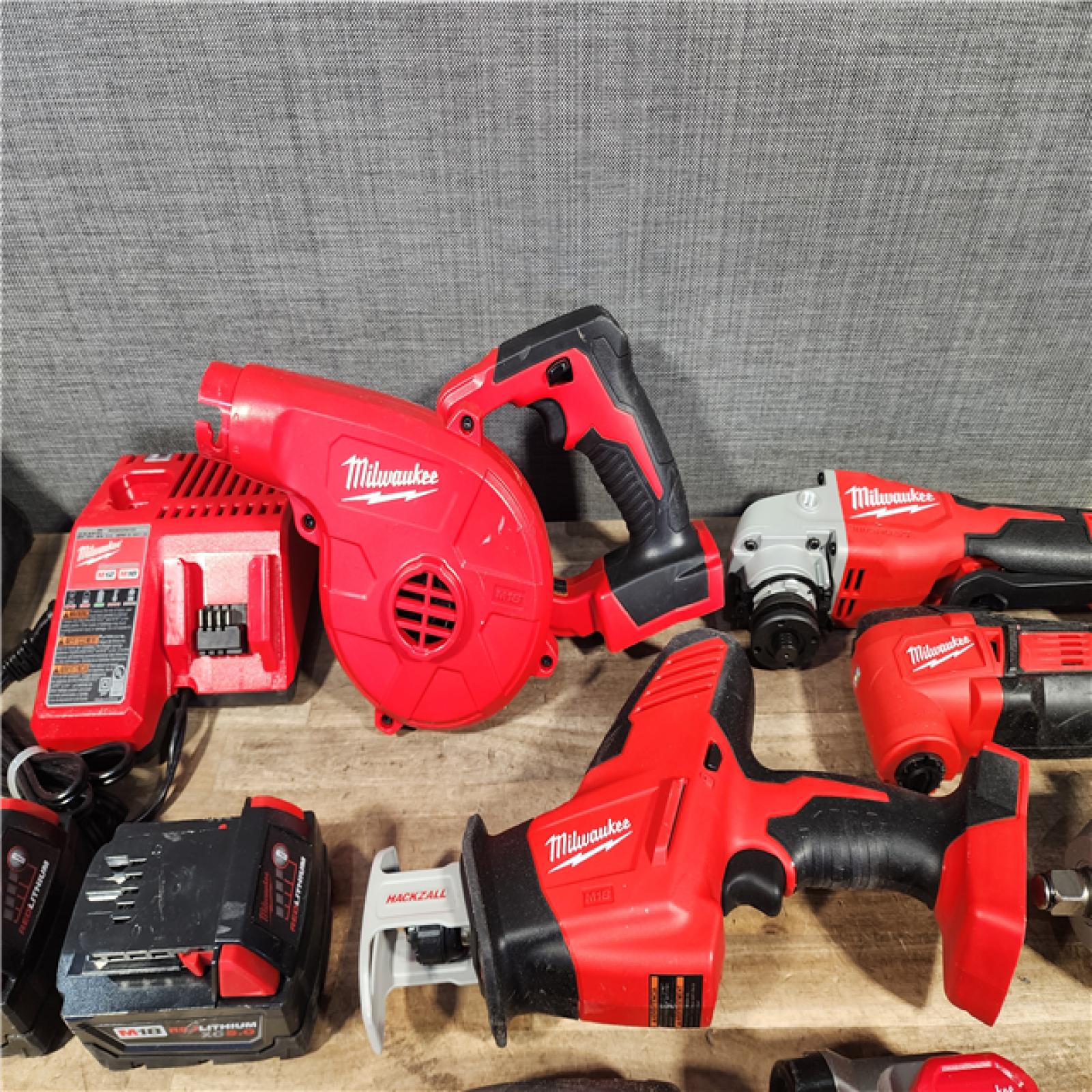 HOUSTON LOCATION - AS-IS MILWAUKEE 7 TOOL COMBO KIT W/ (2) BATTERY & CHARGER