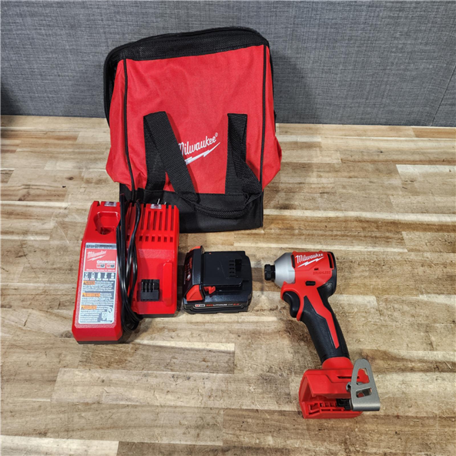 HOUSTON LOCATION - AS - IS Milwaukee 18-Volt Lithium-Ion Compact Brushless Cordless 1/4 in. Impact Driver Kit