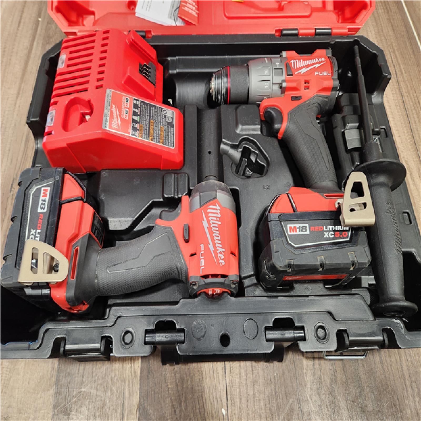 AS-IS Milwaukee M18 FUEL 18V Lithium-Ion Brushless Cordless Hammer Drill and Impact Driver Combo Kit (2-Tool) with 2 Batteries