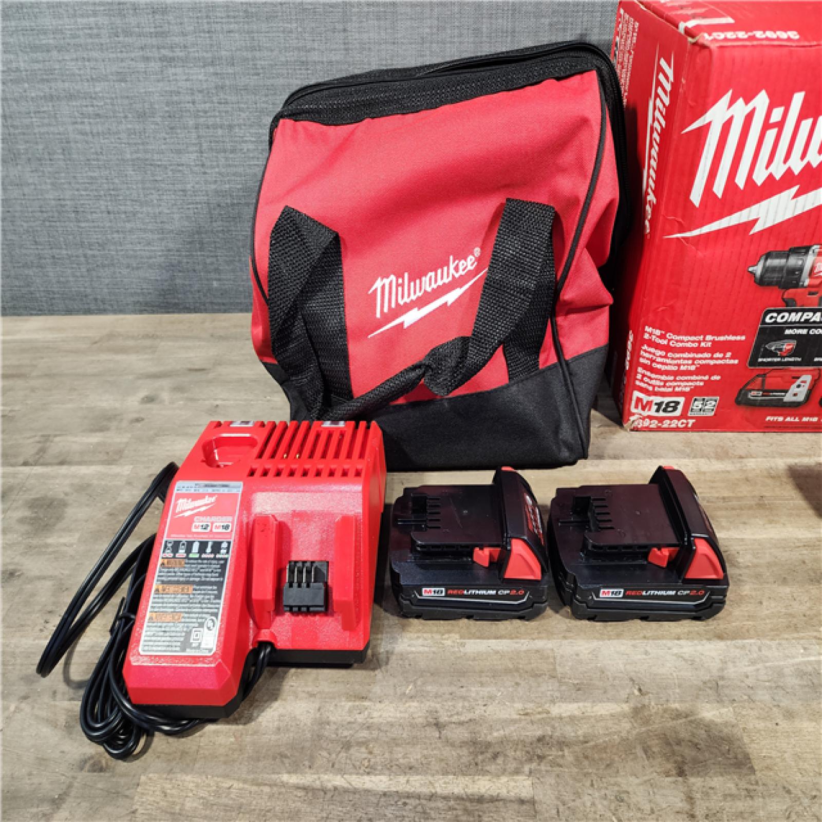 HOUSTON LOCATION - AS-IS Milwaukee M18 18V Lithium-Ion Brushless Cordless Compact Drill/Impact Combo Kit (2-Tool) W/(2) 2.0 Ah Batteries  Charger & Bag
