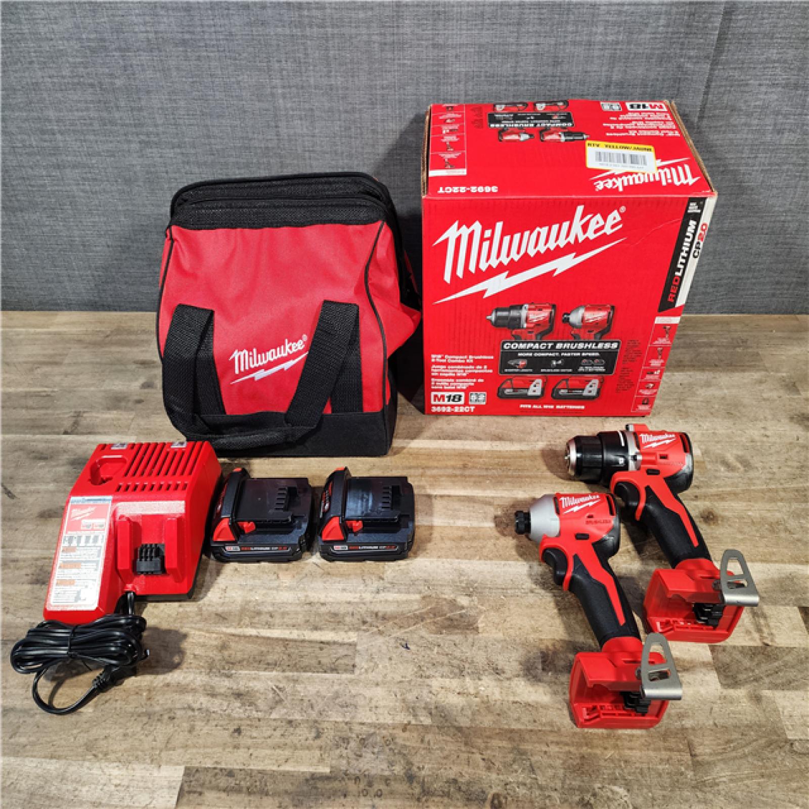 HOUSTON LOCATION - AS-IS Milwaukee M18 18V Lithium-Ion Brushless Cordless Compact Drill/Impact Combo Kit (2-Tool) W/(2) 2.0 Ah Batteries  Charger & Bag