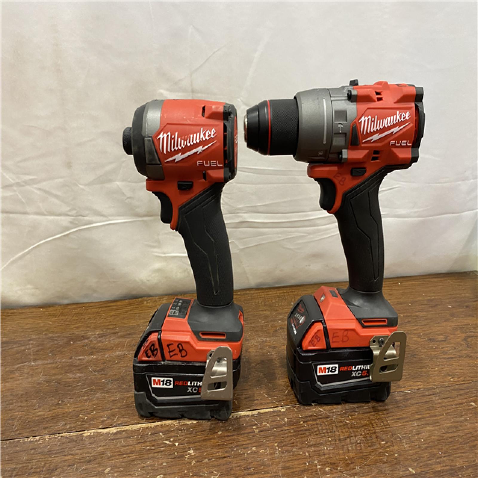 AS-IS MILWAUKEE M18 FUEL 18V Lithium-Ion Brushless Cordless Hammer Drill and Impact Driver Combo Kit (2-Tool) with 2 Batteries