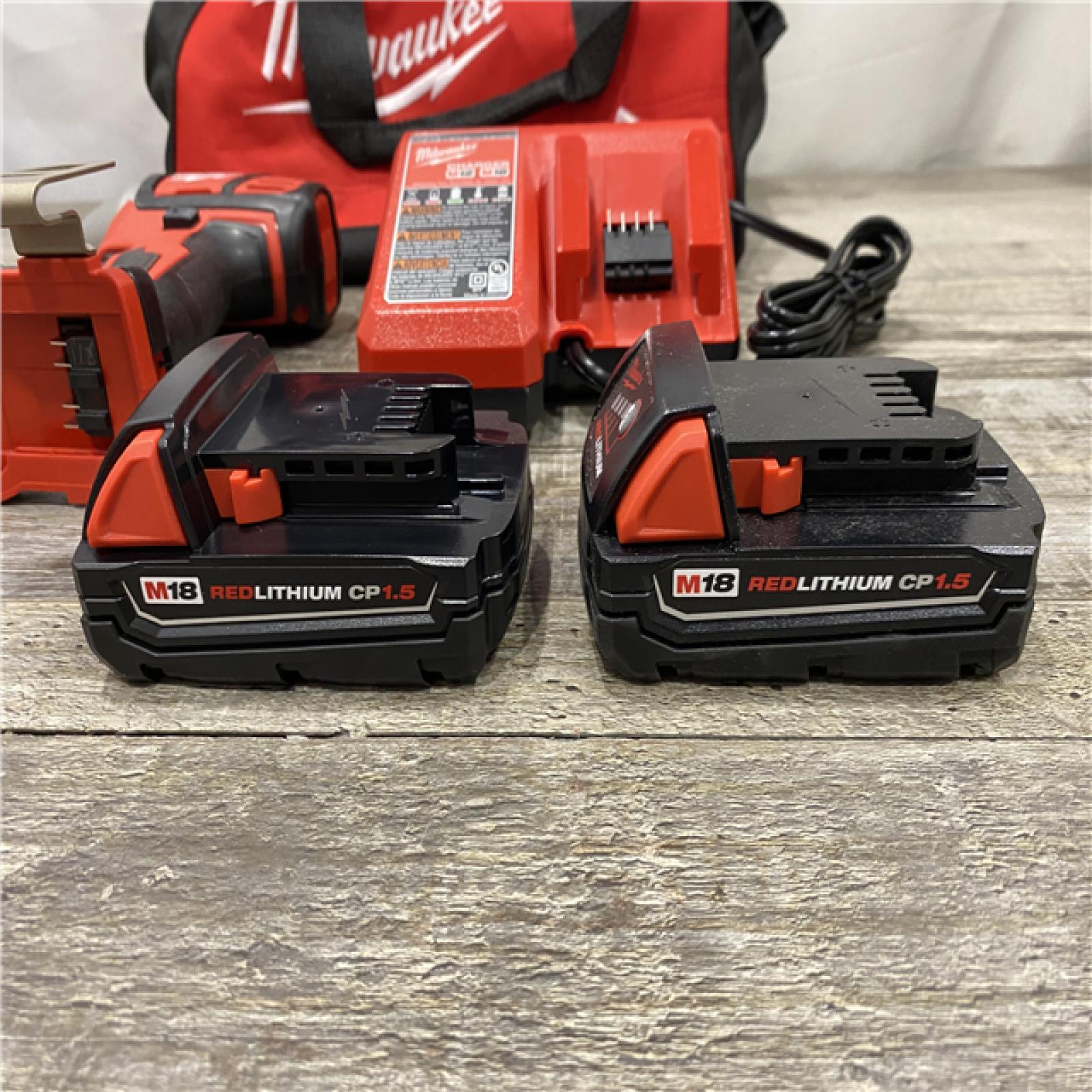 AS-IS Milwaukee 18V Lithium-Ion Cordless 1/4 in. Impact Driver Kit