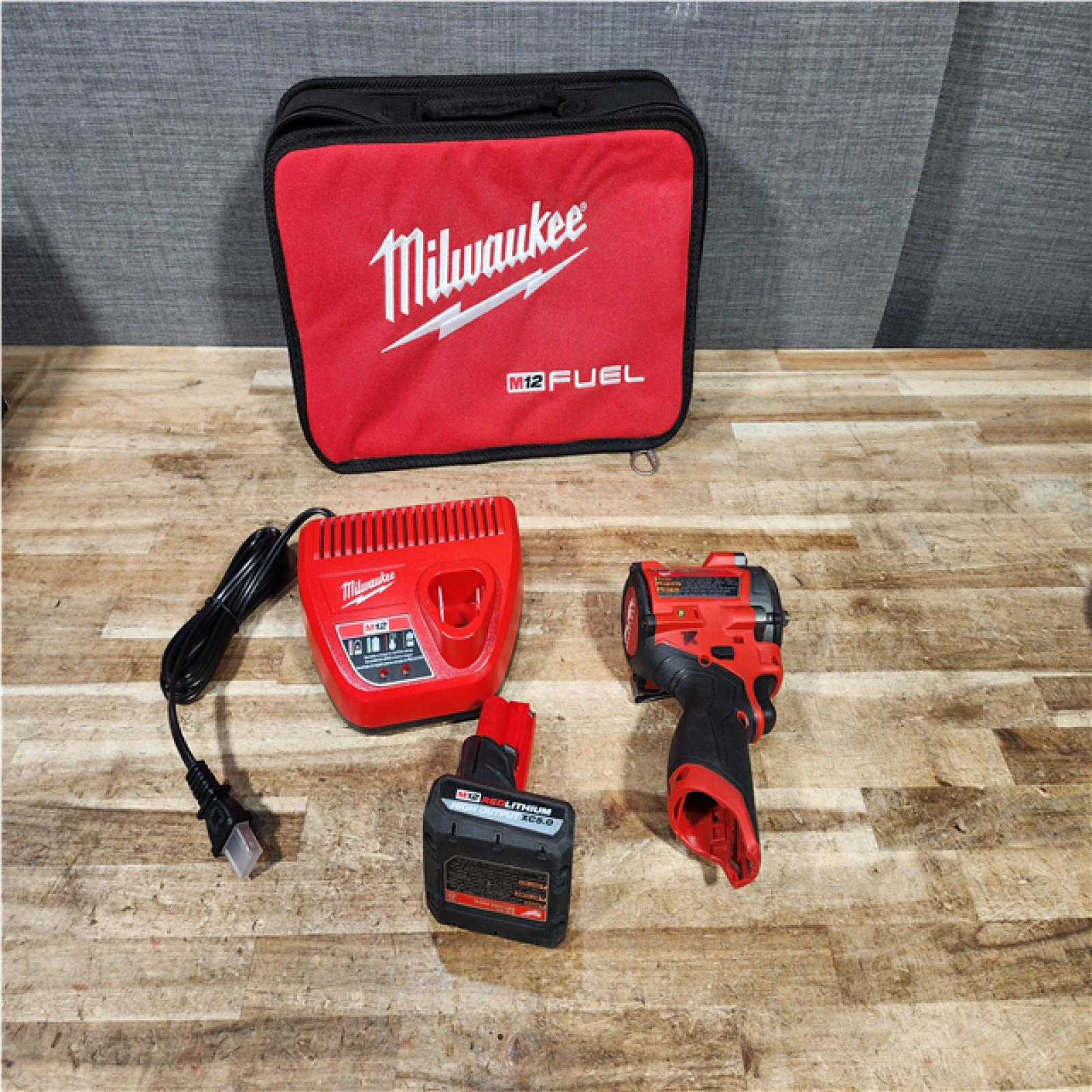 Houston Location AS-IS Milwaukee FUEL Impact and Battery with Charger