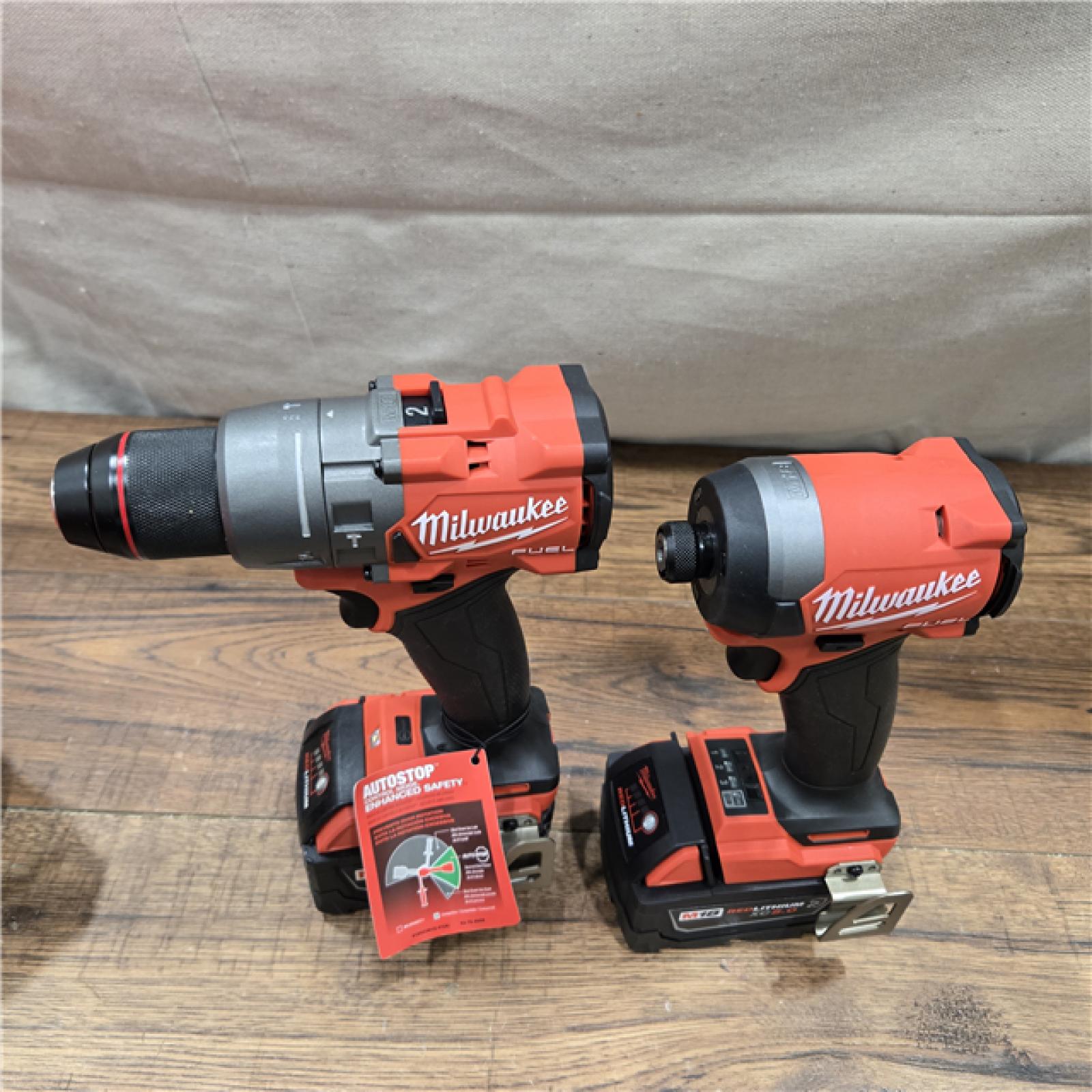 AS-IS MILWAUKEE FUEL 18V Lithium-Ion Brushless Cordless Hammer Drill and Impact Driver Combo Kit (2-Tool) with 2 Batteries