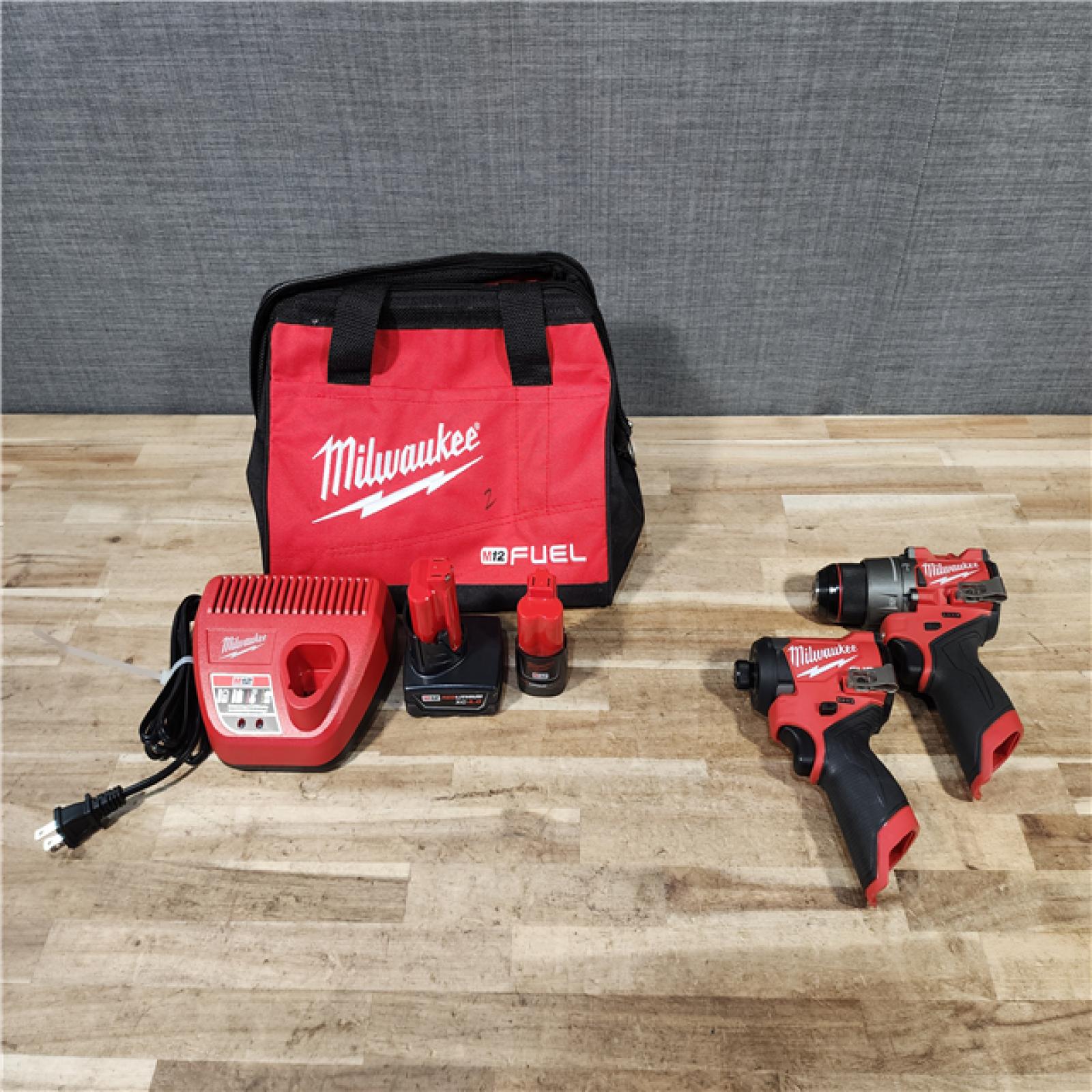HOUSTON LOCATION - AS-IS Milwaukee FUEL 12-Volt Lithium-Ion Brushless Cordless Hammer Drill and Impact Driver Combo Kit
