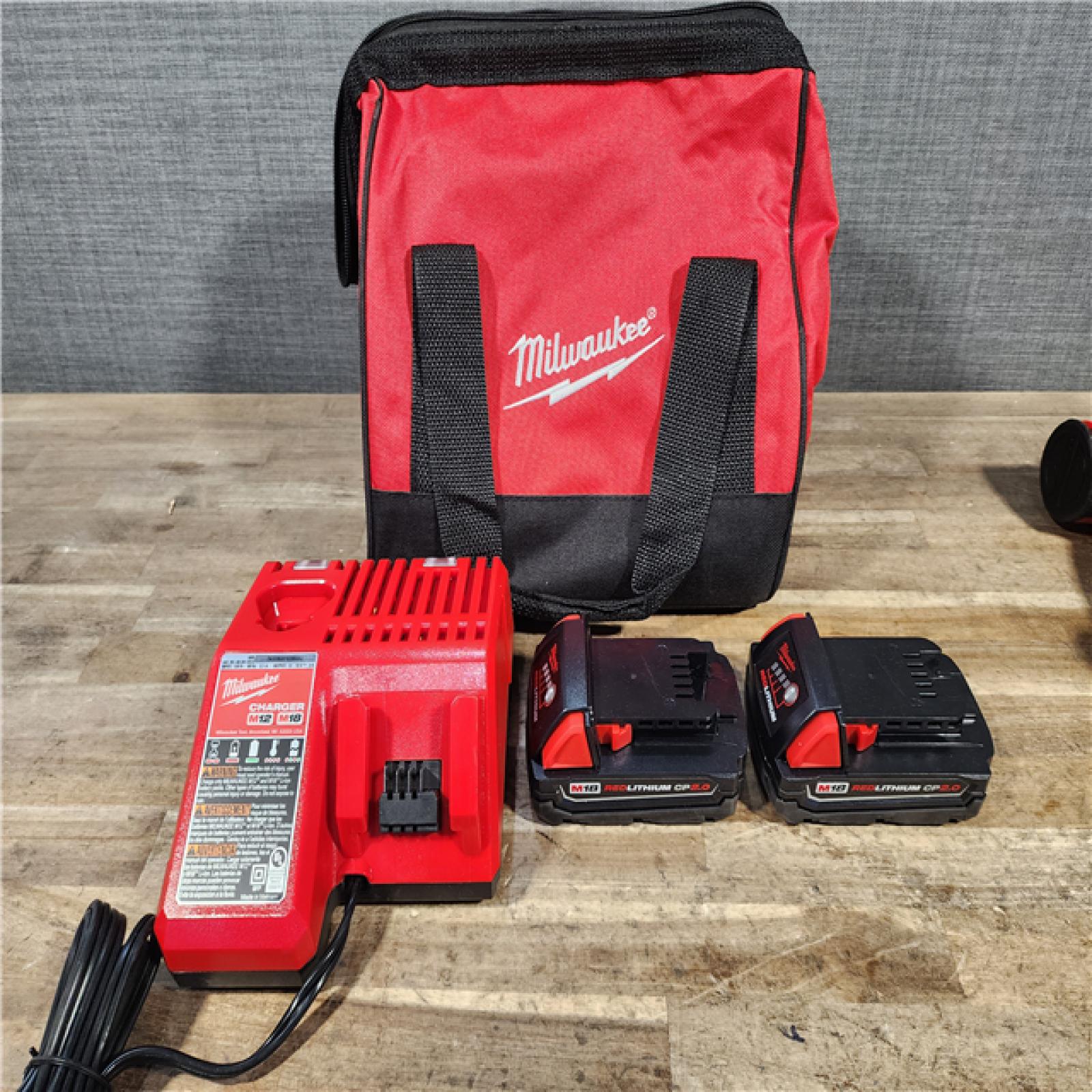 HOUSTON LOCATION - AS-IS Milwaukee M18 18V Lithium-Ion Brushless Cordless Compact Drill/Impact Combo Kit (2-Tool) W/(2) 2.0 Ah Batteries  Charger & Bag