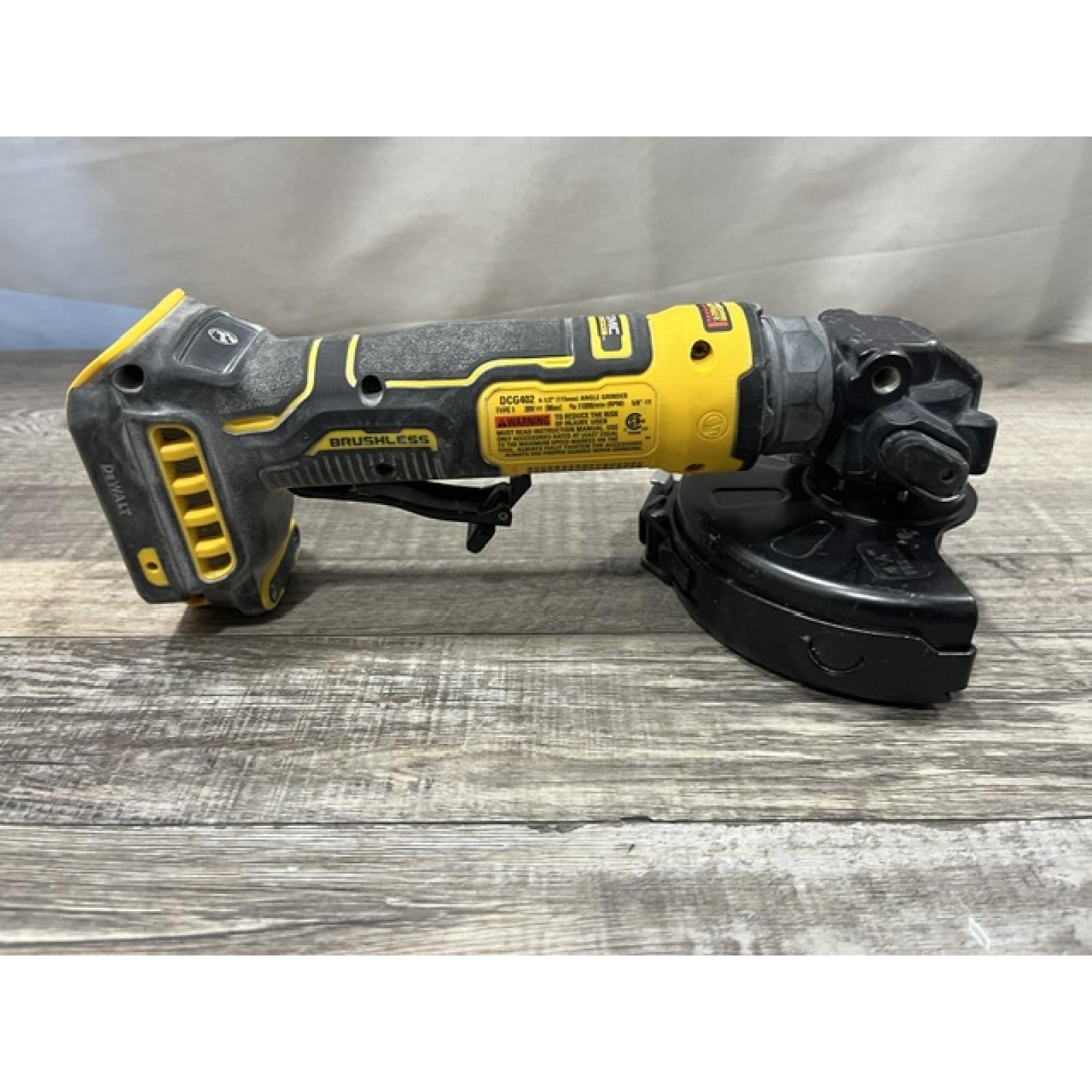 AS-IS DEWALT ATOMIC 20V MAX Cordless 4-1/2 in. Angle Grinder with Paddle Switch (Tool Only)