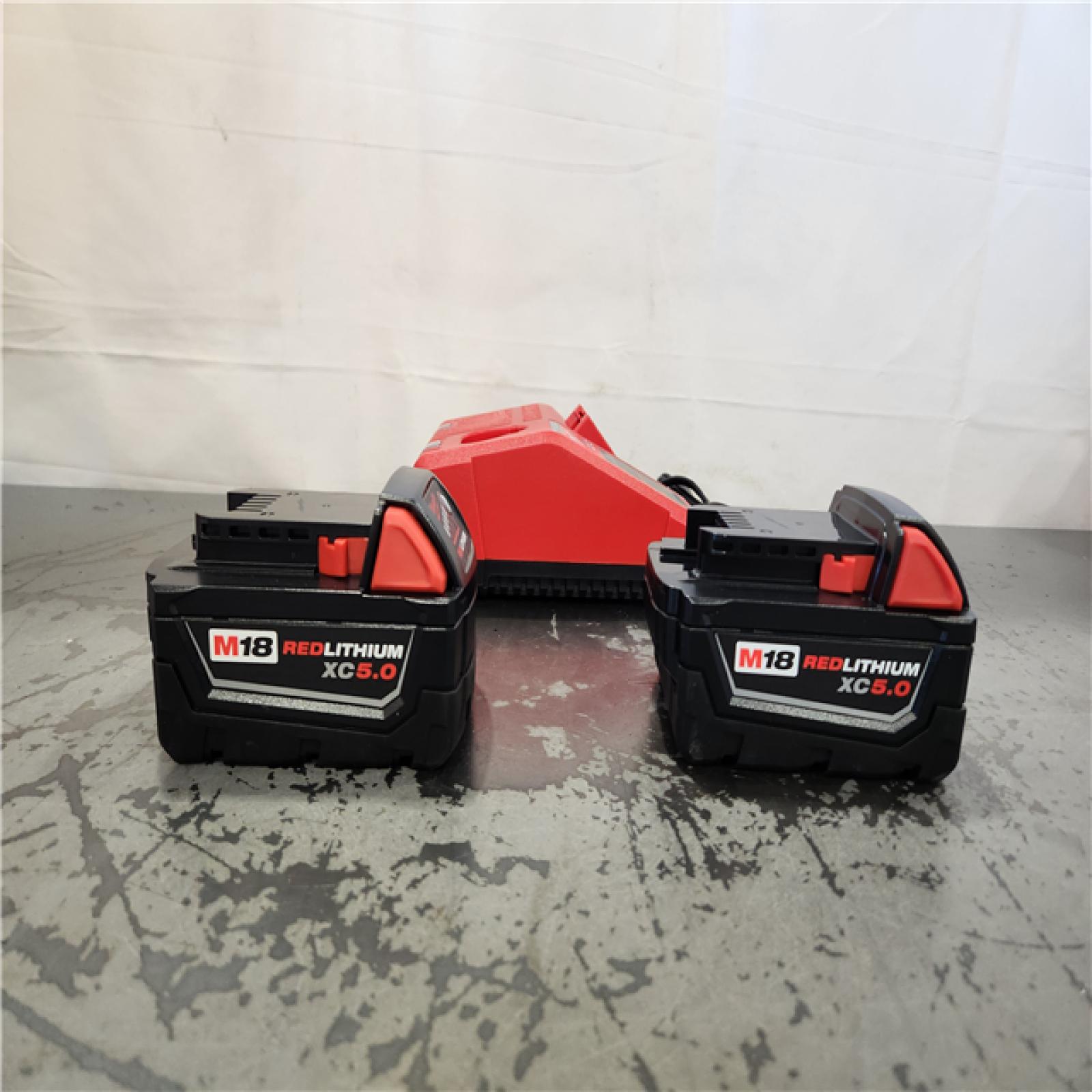 AS-IS- Milwaukee 18-Volt Lithium-Ion XC Starter Kit with Two 5.0Ah Batteries and Charger