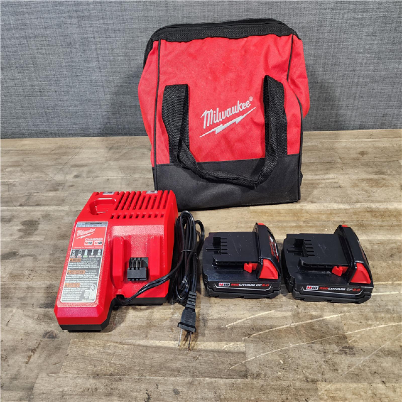 HOUSTON LOCATION - AS-IS Milwaukee M18 18V Lithium-Ion Brushless Cordless Compact Drill/Impact Combo Kit (2-Tool) W/(2) 2.0 Ah Batteries  Charger & Bag