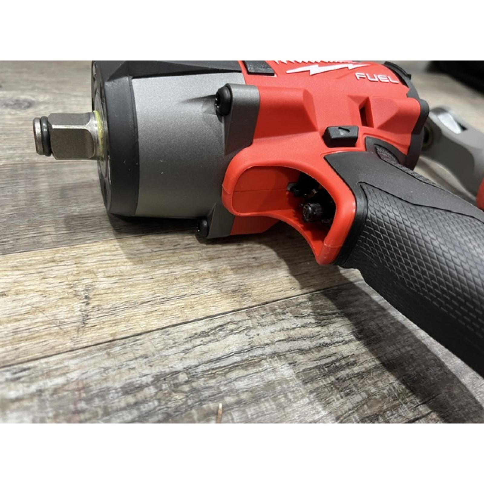 AS-IS Milwaukee FUEL 18V Cordless Mid Torque 1/2 in. Impact Wrench w/ 12 FUEL 3/8 in. Ratchet Combo Kit