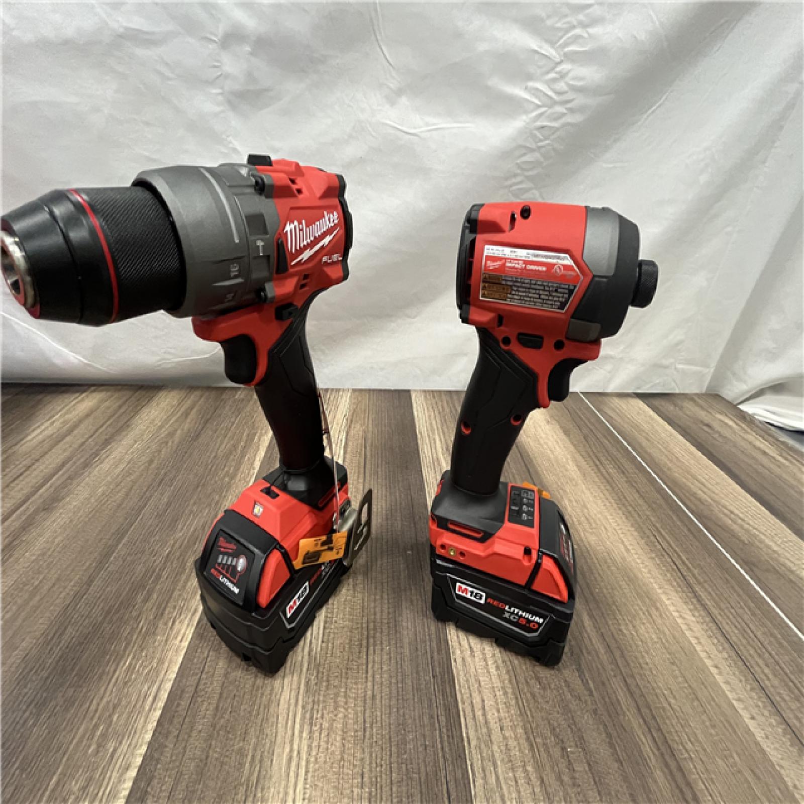 AS-IS Milwaukee M18 FUEL 18V Lithium-Ion Brushless Cordless Hammer Drill and Impact Driver Combo Kit (2-Tool) with 2 Batteries