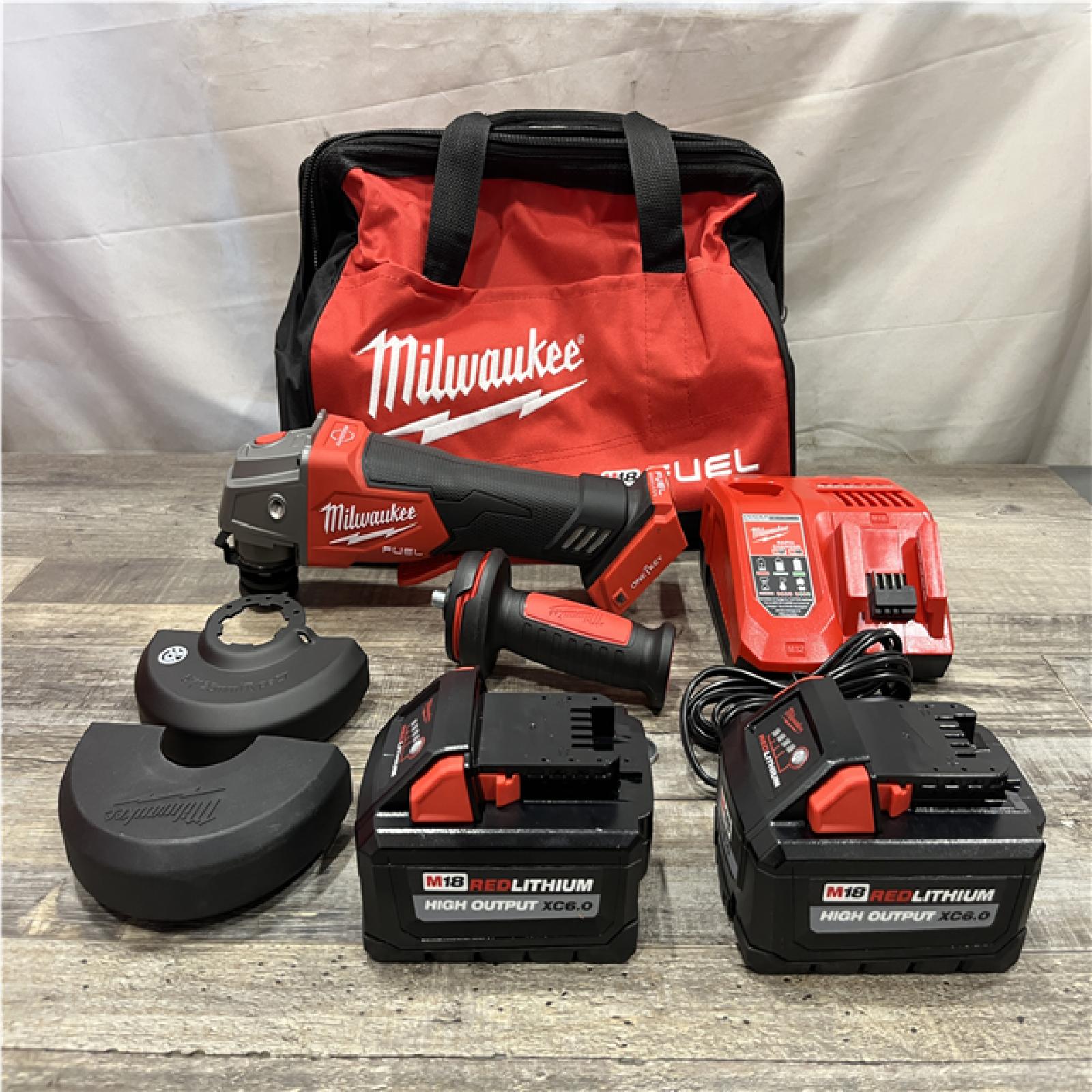 AS-IS Milwaukee FUEL 18V Lithium-Ion Brushless Cordless 4-1/2 in./5 in. Braking Grinder Kit