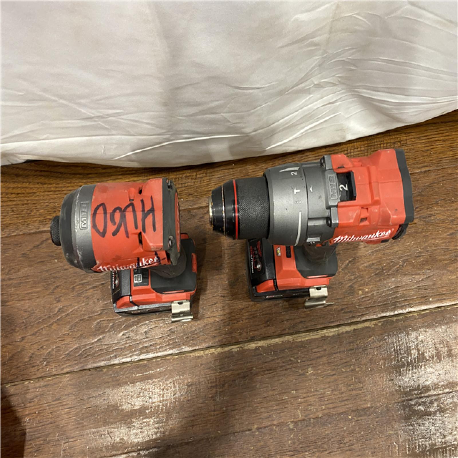 AS-IS MILWAUKEE M18 FUEL 18V Lithium-Ion Brushless Cordless Hammer Drill and Impact Driver Combo Kit (2-Tool) with 2 Batteries