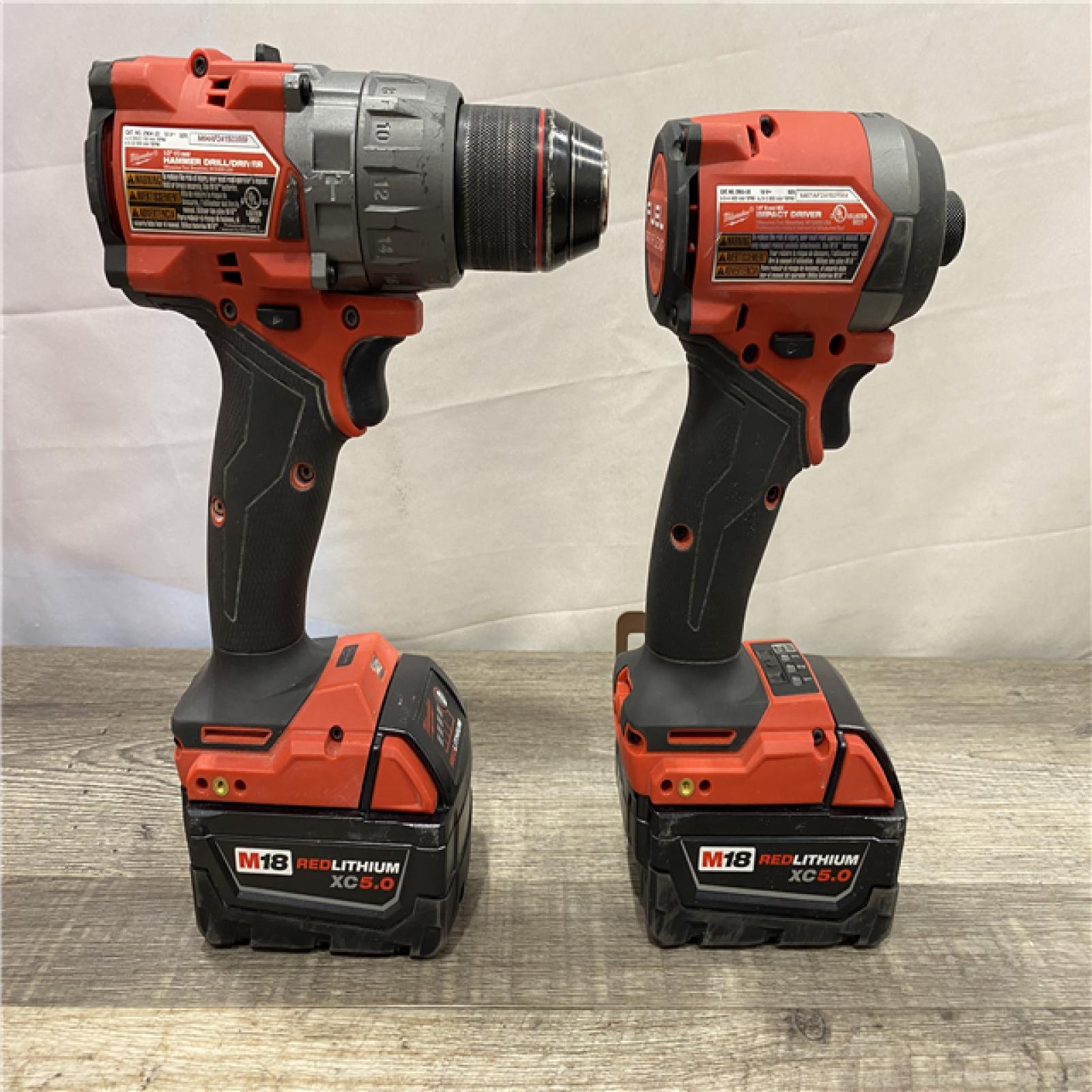 AS-IS Milwaukee FUEL 18V Lithium-Ion Brushless Cordless Hammer Drill and Impact Driver Combo Kit