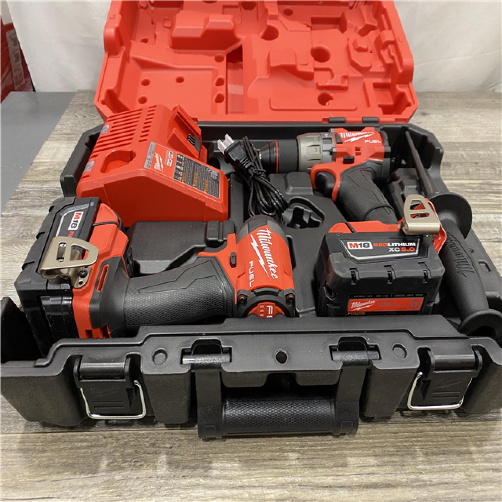 AS-IS Milwaukee FUEL 18V Lithium-Ion Brushless Cordless Hammer Drill and Impact Driver Combo Kit