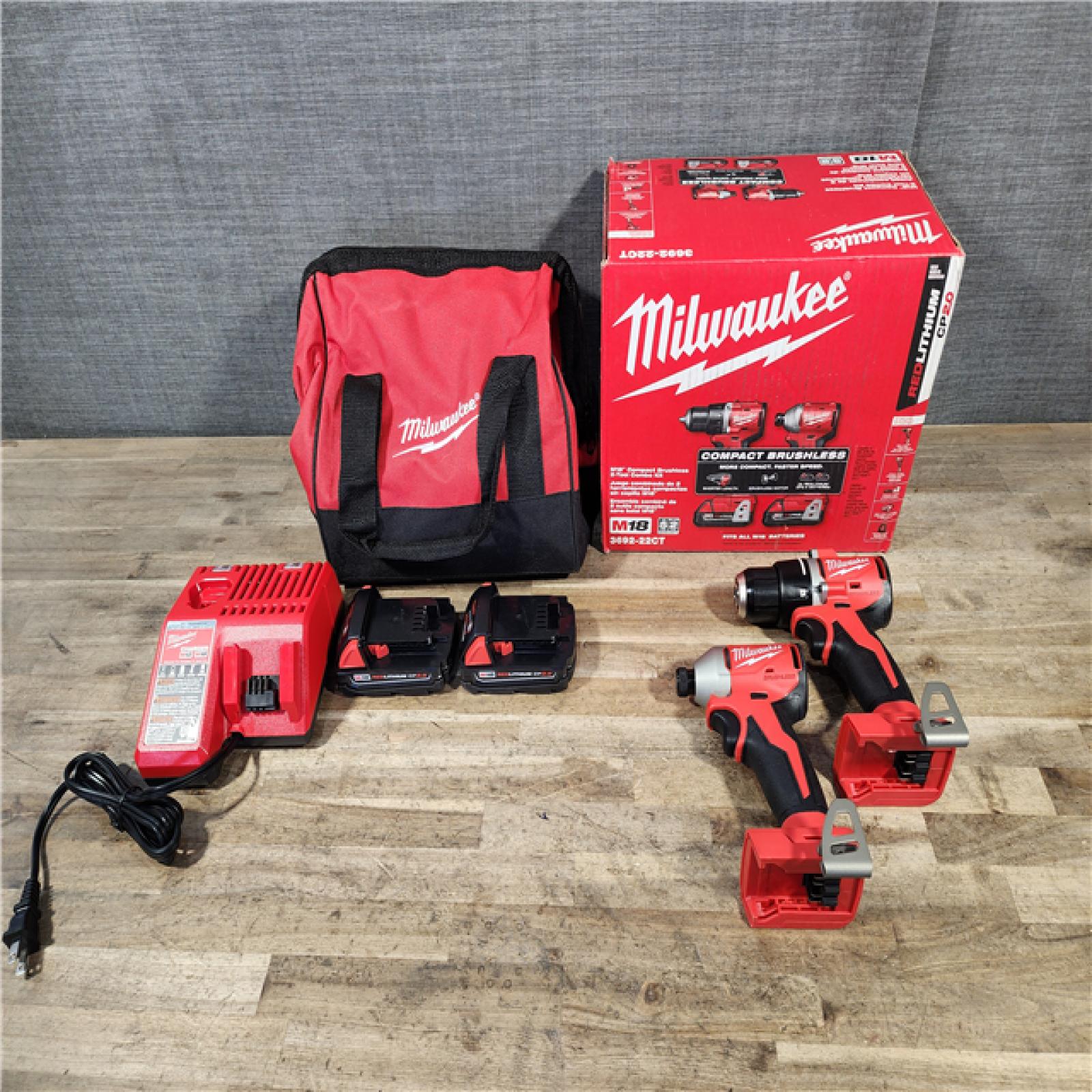 HOUSTON LOCATION - AS-IS Milwaukee M18 18V Lithium-Ion Brushless Cordless Compact Drill/Impact Combo Kit (2-Tool) W/(2) 2.0 Ah Batteries  Charger & Bag