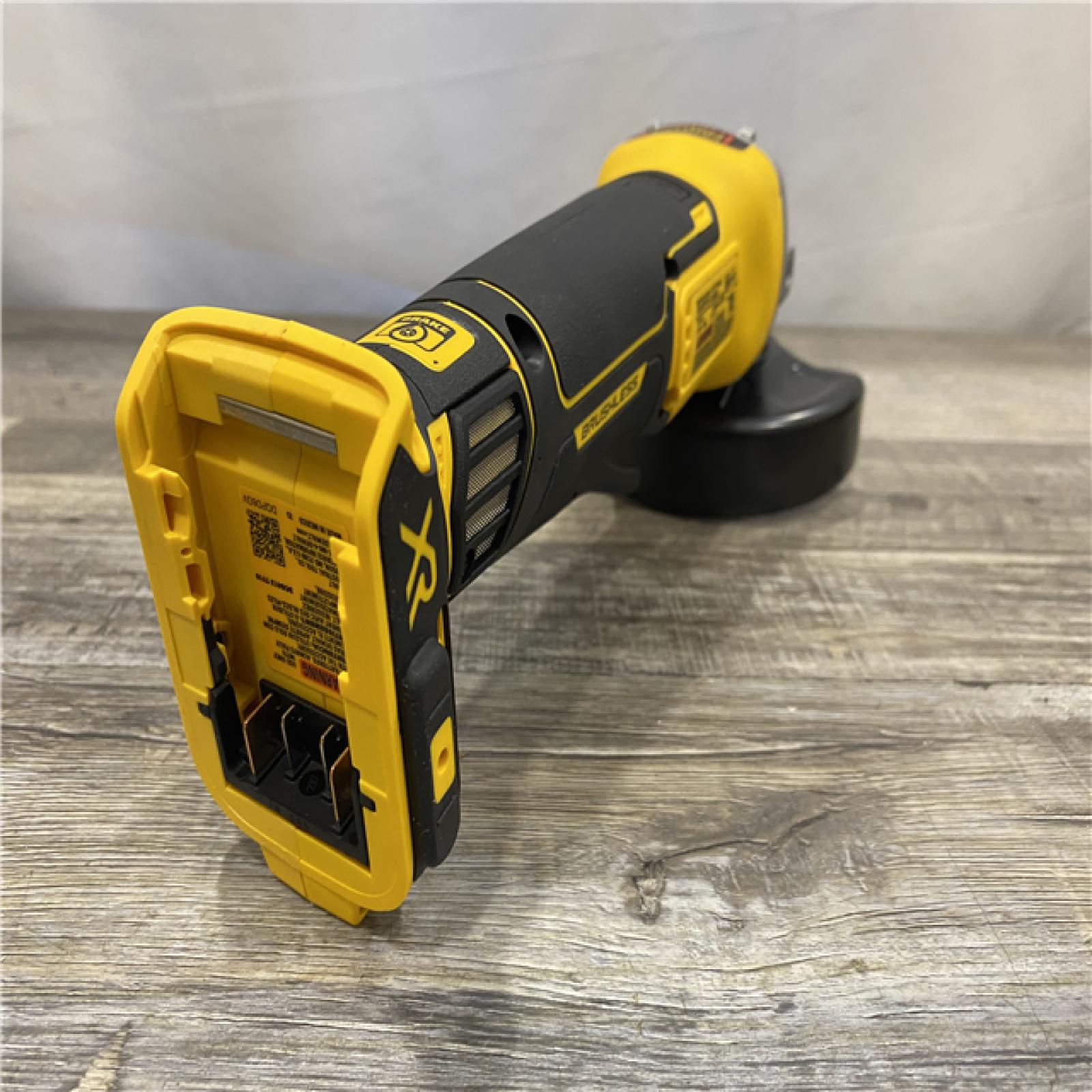 AS-IS DEWALT 20-Volt MAX XR Lithium-Ion Cordless Brushless 4-1/2 in. Paddle Switch Small Angle Grinder w/ Kickback Brake (Tool-Only)