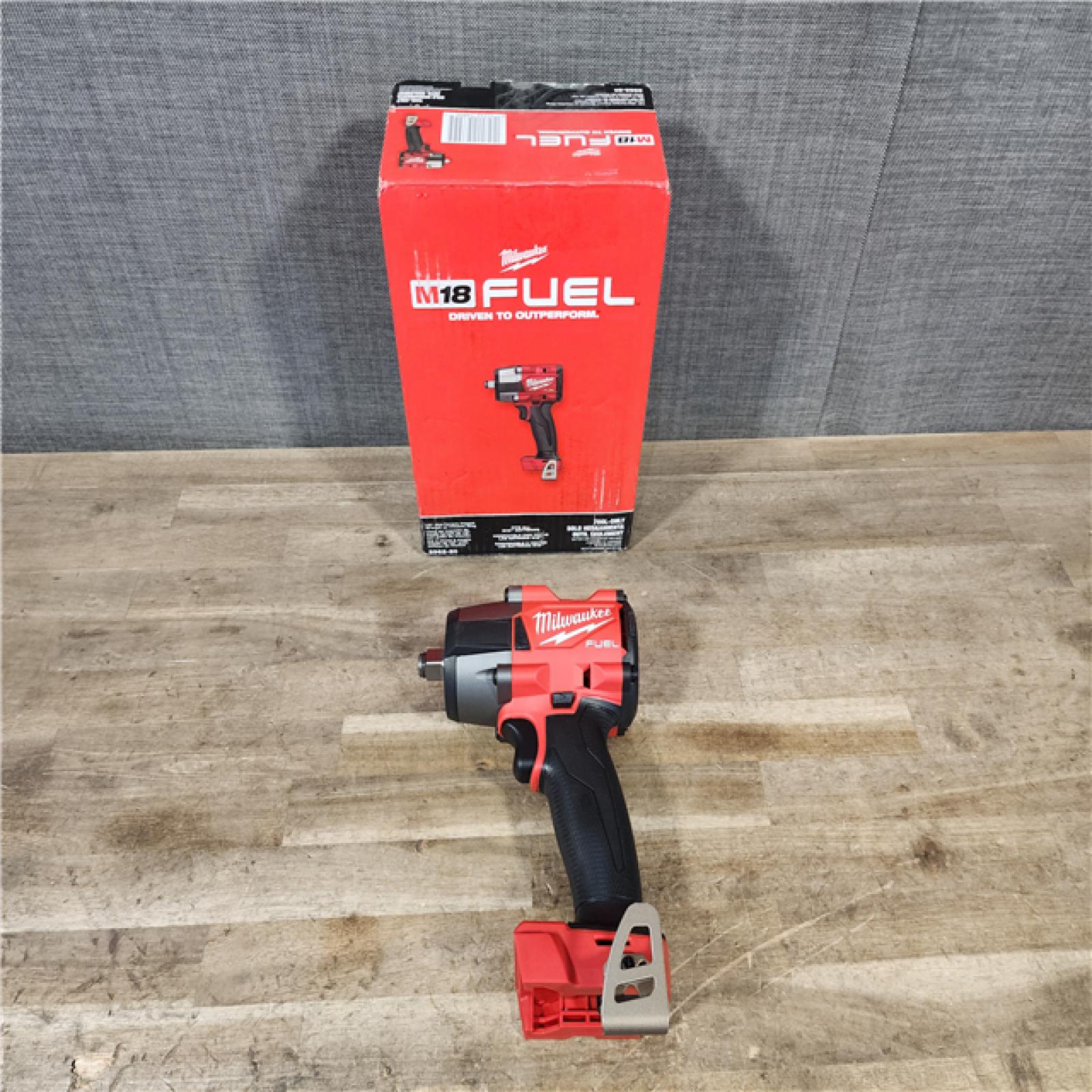 HOUSTON LOCATION - AS-IS (APPEARS LIKE NEW) Milwaukee 2962-20  M18 18V Fuel 1/2 Mid-Torque Impact Wrench Cordless Lithium-Ion Brushless (Tool-Only)