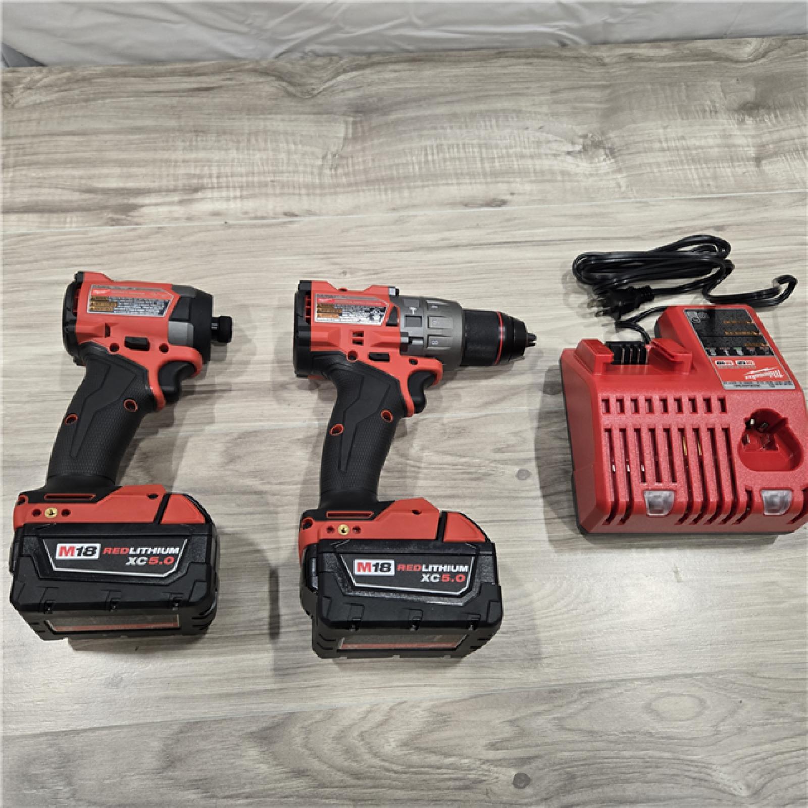 AS-IS MILWAUKEE FUEL 18V Lithium-Ion Brushless Cordless Hammer Drill and Impact Driver Combo Kit (2-Tool) with 2 Batteries