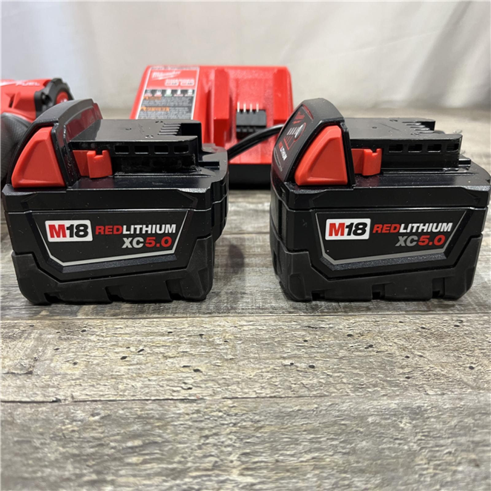 AS-IS Milwaukee FUEL 18V Lithium-Ion Brushless Cordless 1/2 in. Mid-Torque Impact Wrench with Friction Ring Kit