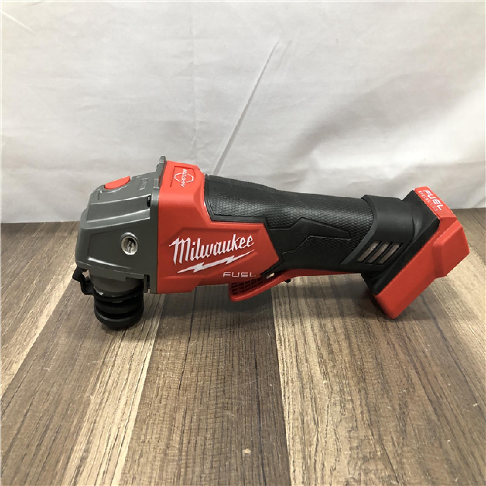 AS-IS Milwaukee FUEL 18V Lithium-Ion Brushless Cordless 4-1/2 in./5 in. Grinder w/Paddle Switch (Tool-Only)