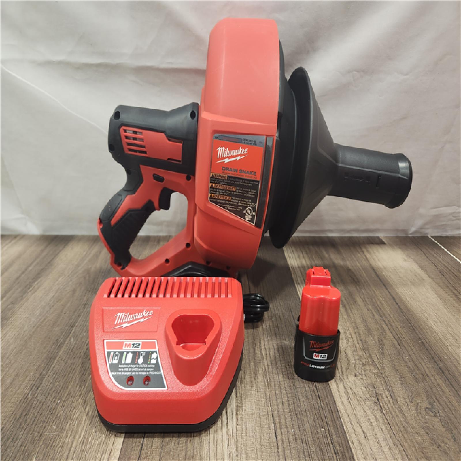 AS-IS- M12 12-V Lithium-Ion Cordless Drain Snake Auger W/ (1) 1.5Ah Battery  5/16 in. X 25 Ft. Cable  Charger  & 5 Gal. Bucket