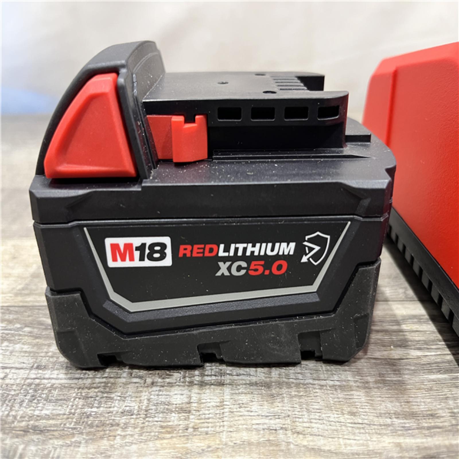 AS-IS Milwaukee 18-Volt Lithium-Ion XC Starter Kit with One 5.0Ah Battery and Charger