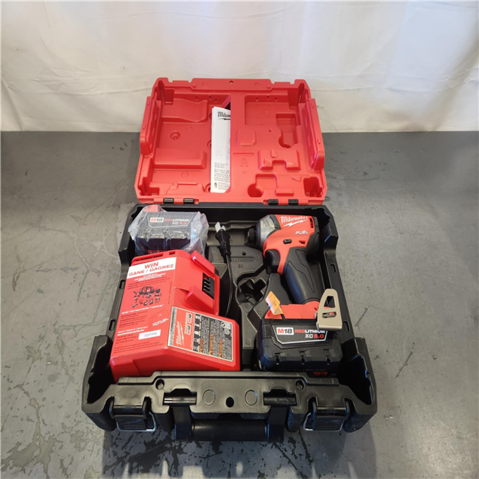 AS-IS- Milwaukee M18 FUEL SURGE 18-Volt Lithium-Ion Brushless Cordless 1/4 in. Hex Impact Driver Compact Kit with Two 5.0 Ah Batteries