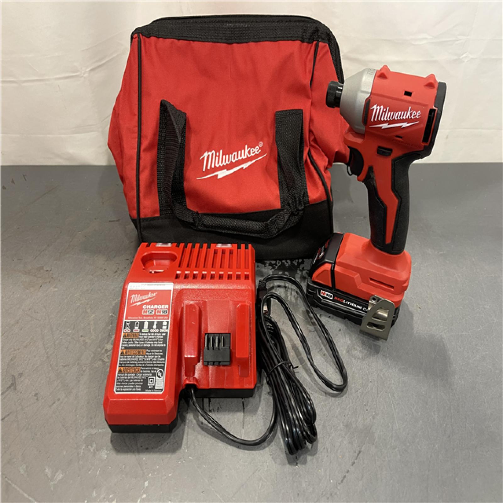 AS-IS - Milwaukee M18 18-Volt Lithium-Ion Compact Brushless Cordless 1/4 in. Impact Driver Kit