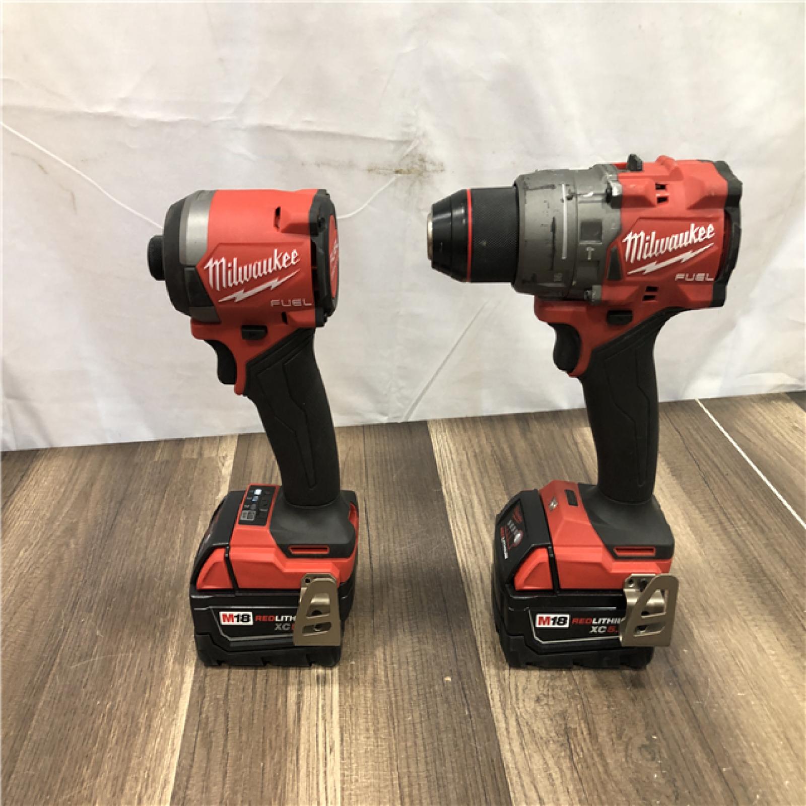 AS-IS Milwaukee FUEL 18V Lithium-Ion Brushless Cordless Hammer Drill and Impact Driver Combo Kit