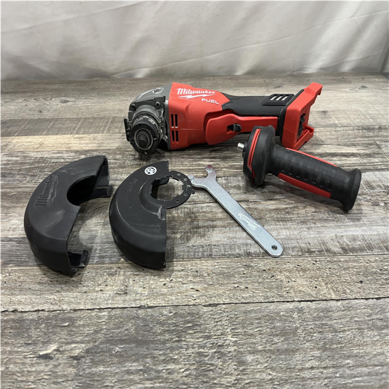 AS-IS Milwaukee FUEL 18V Lithium-Ion Brushless Cordless 4-1/2 in./5 in. Grinder w/Paddle Switch (Tool-Only)