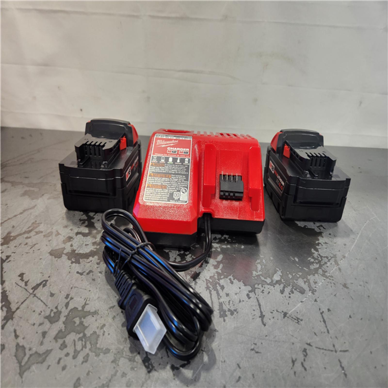 AS-IS- Milwaukee M18 18-Volt Lithium-Ion XC Starter Kit with Two 5.0Ah Batteries and Charger