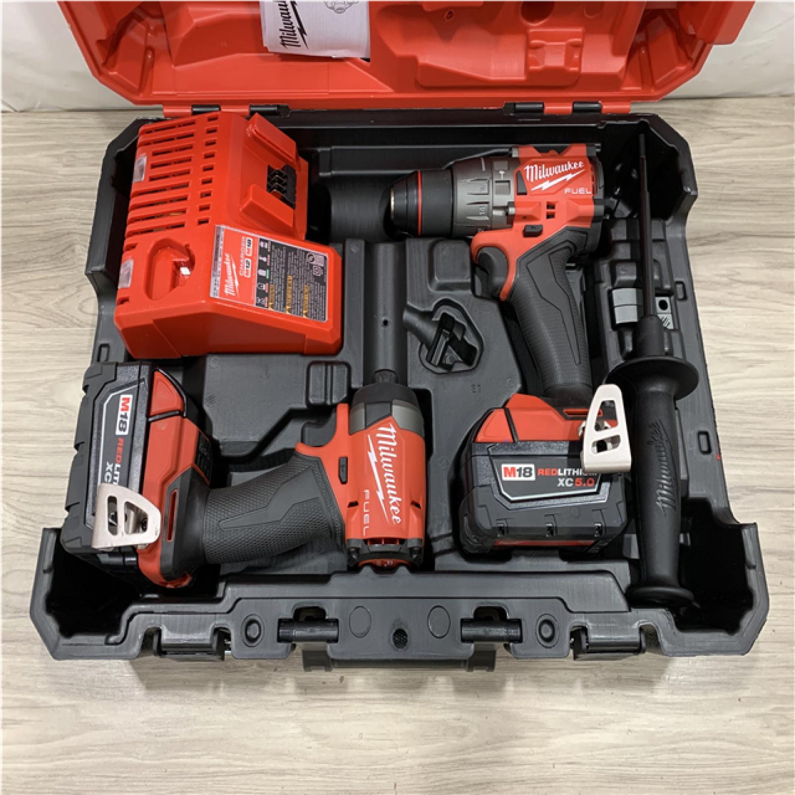 AS-IS Milwaukee FUEL 18V Lithium-Ion Brushless Cordless Hammer Drill and Impact Driver Combo Kit