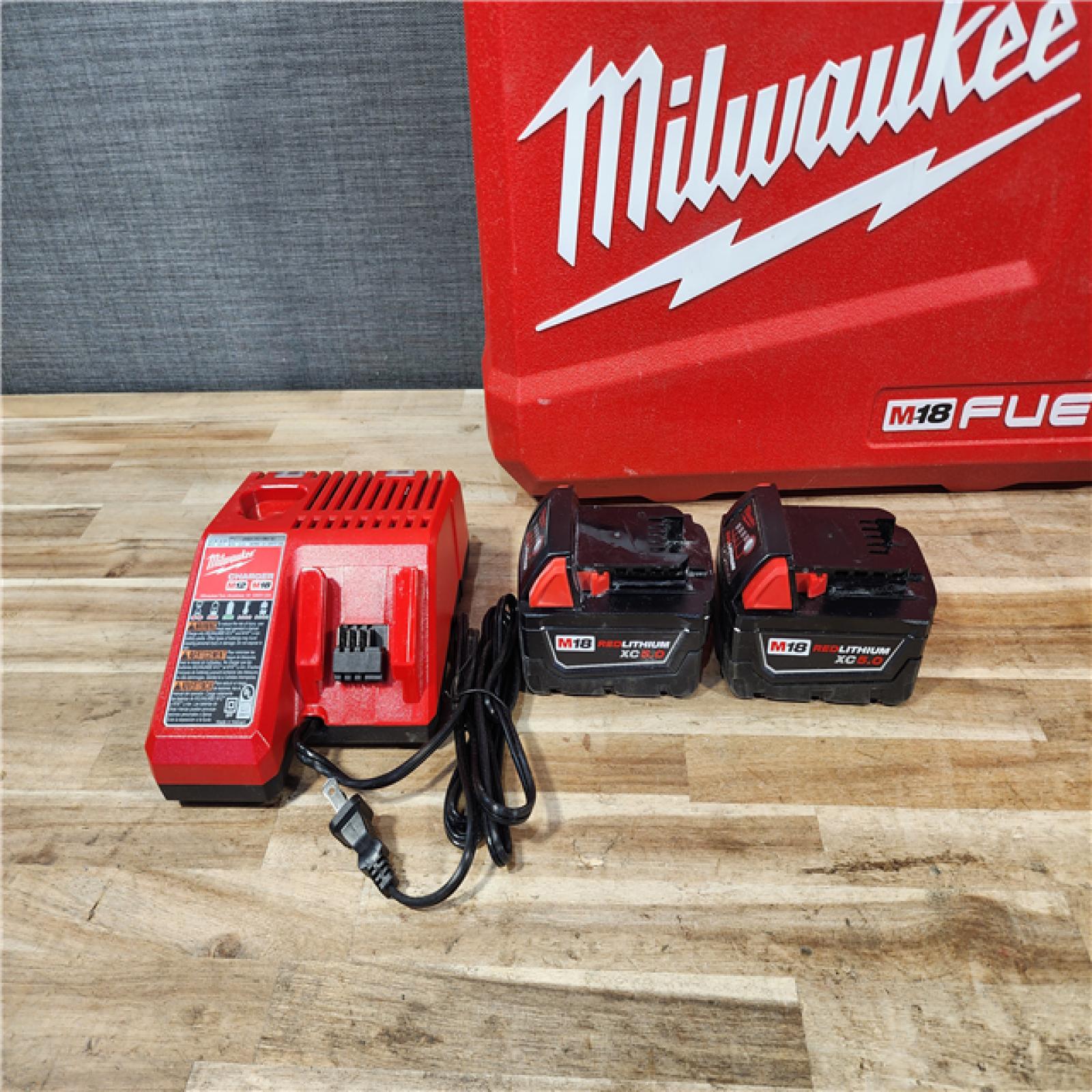 HOUSTON LOCATION - AS-IS Milwaukee FUEL 18V Lithium-Ion Brushless Cordless Hammer Drill and Impact Driver Combo Kit