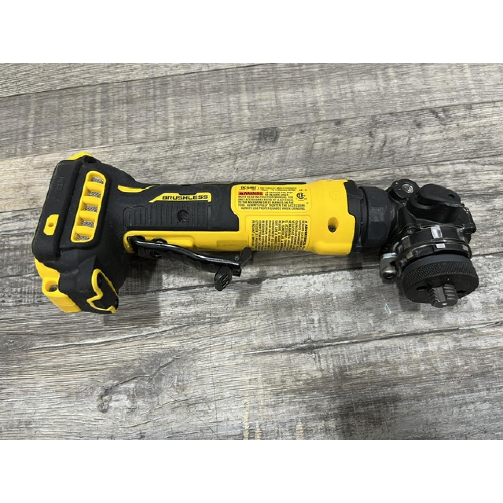 AS-IS DEWALT ATOMIC 20V MAX Cordless 4-1/2 in. Angle Grinder with Paddle Switch (Tool Only)
