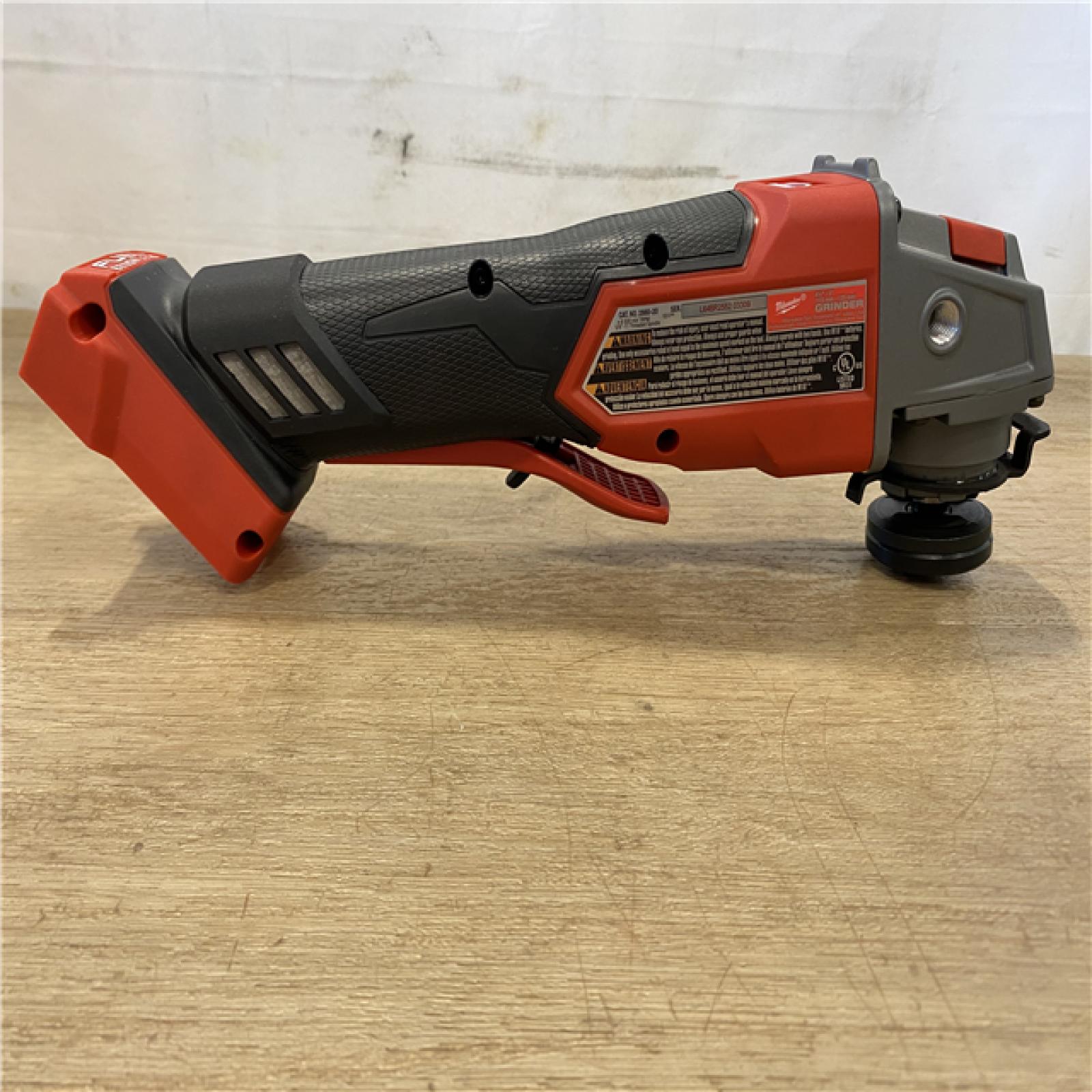 AS-IS Milwaukee FUEL 18V Lithium-Ion Brushless Cordless 4-1/2 in./5 in. Grinder w/Paddle Switch (Tool-Only)