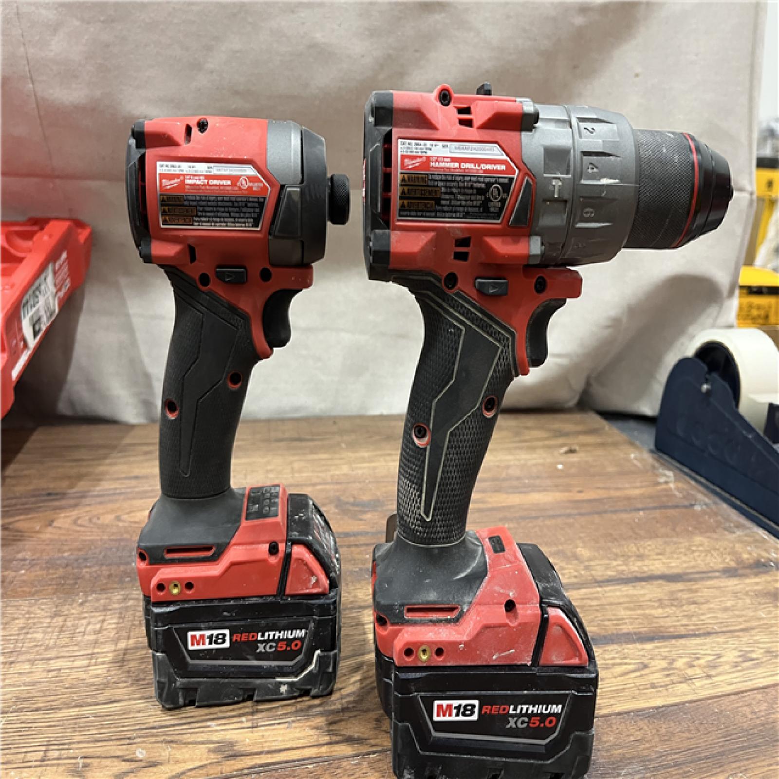 AS-IS Milwaukee M18 FUEL 18V Lithium-Ion Brushless Cordless Hammer Drill and Impact Driver Combo Kit (2-Tool) with 2 Batteries