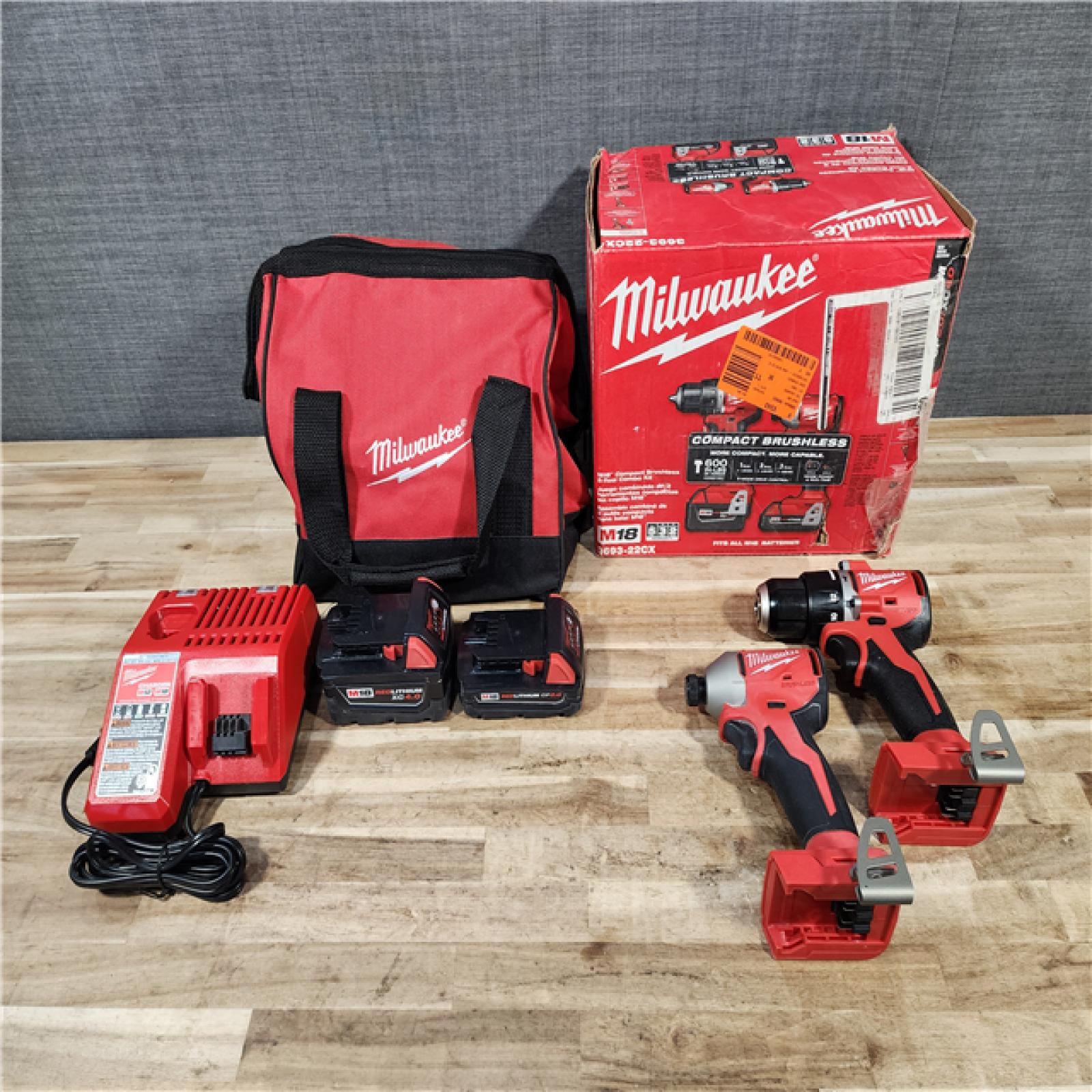 HOUSTON LOCATION - AS-IS M18 18-Volt Lithium-Ion Brushless Cordless Compact Hammer Drill/Impact Combo Kit (2-Tool) with (2) Batteries  Bag