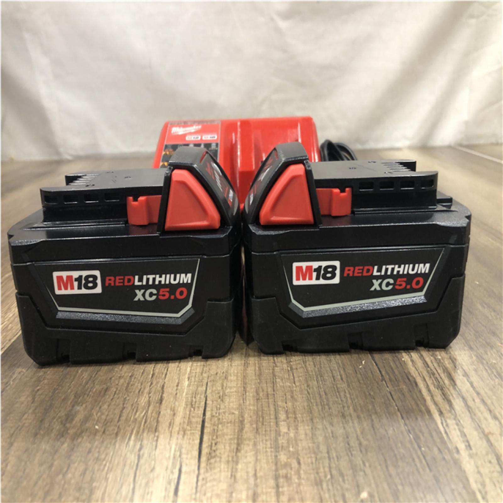 AS-IS Milwaukee 18-Volt Lithium-Ion XC Starter Kit with (2) 5.0Ah Batteries and Charger