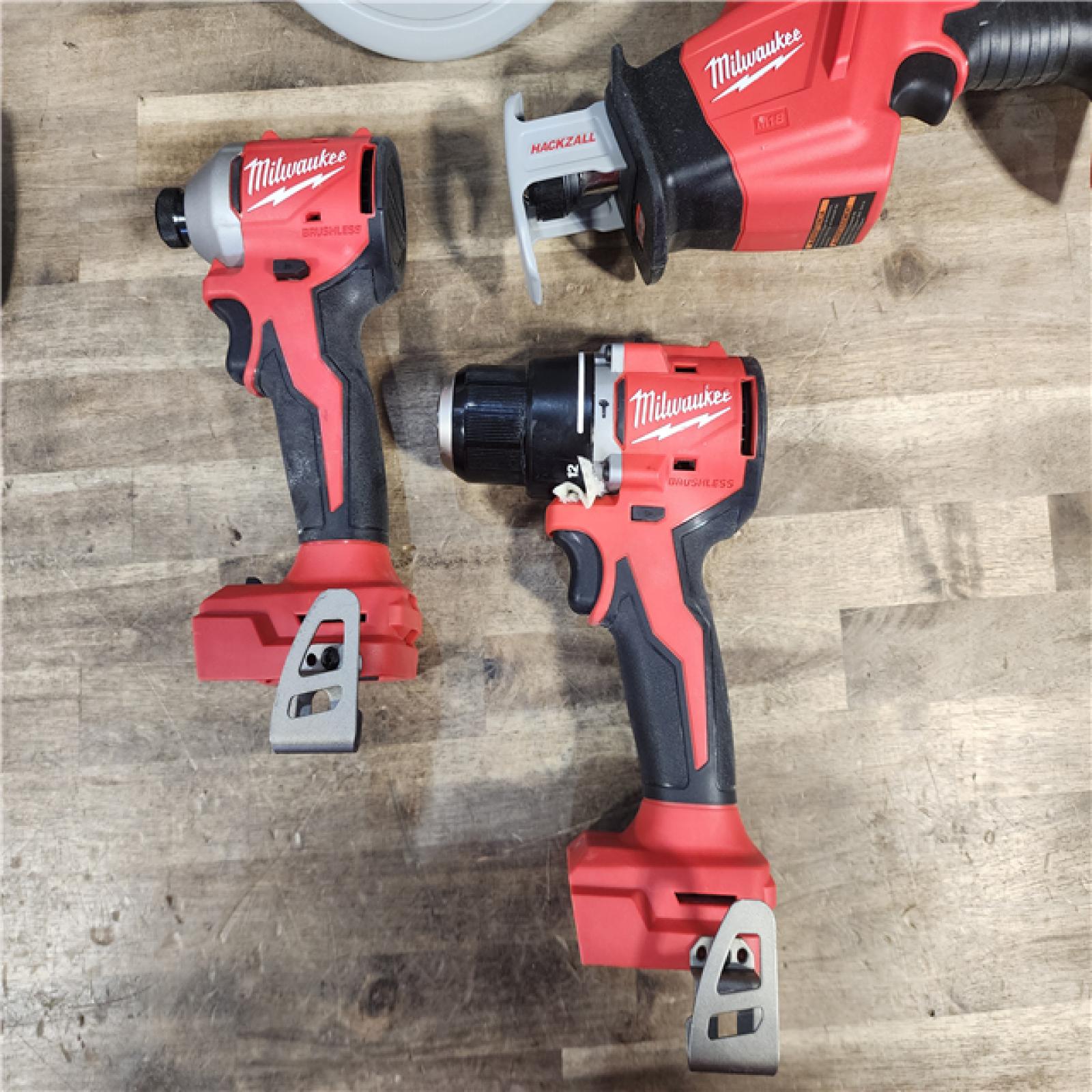 HOUSTON LOCATION - AS-IS Milwaukee M18 18-Volt Lithium-Ion Brushless Cordless Combo Kit (4-Tool) with 2-Batteries, 1-Charger and Tool Bag