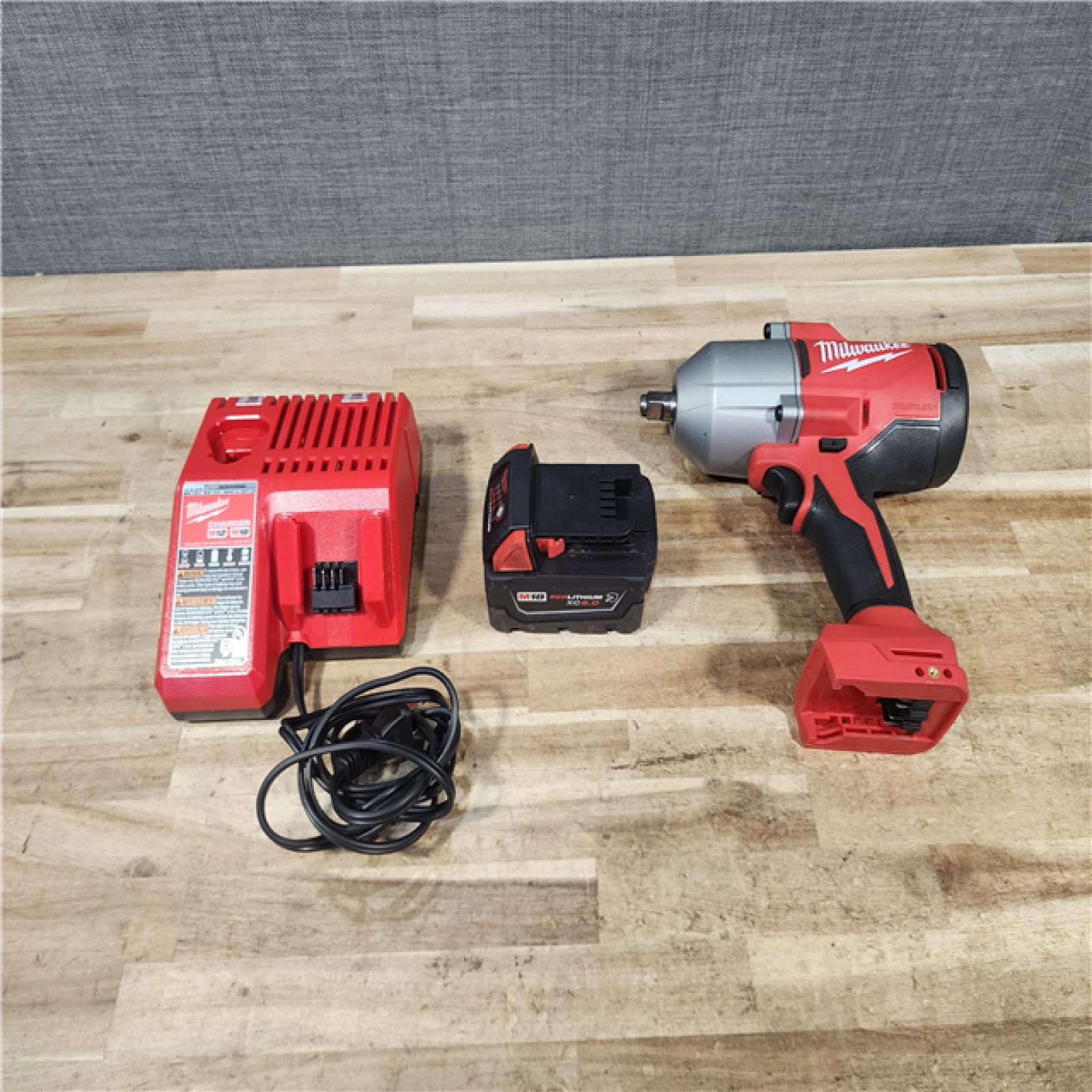 HOUSTON LOCATION - AS - IS Milwaukee 18-Volt Lithium-Ion Brushless 1/2 in. High Torque Impact Wrench with Friction Ring W/ BATTERY & CHARGER