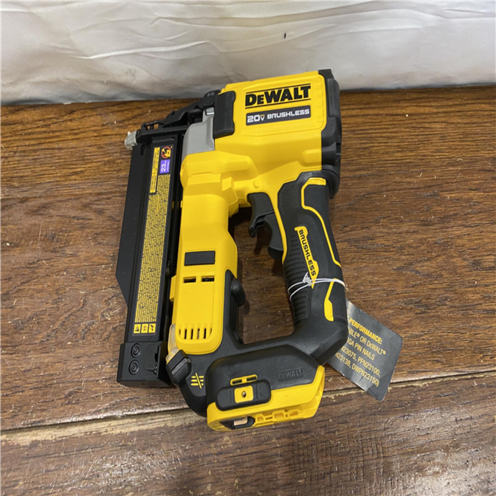 AS-IS DEWALT ATOMIC 20V MAX Lithium Ion Cordless 23 Gauge Pin Nailer Kit with 3.0Ah Battery and Charger