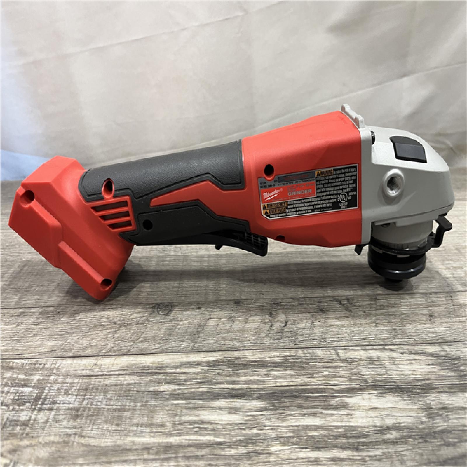 AS-IS Milwaukee 18V Lithium-Ion Brushless Cordless 4-1/2 in./5 in. Grinder w/Paddle Switch (Tool-Only)