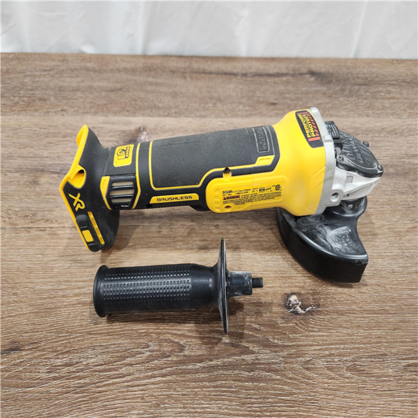 AS-IS DEWALT 20V MAX XR Brushless Cordless 4-1/2 in. Slide Switch Small Angle Grinder (Tool-Only)
