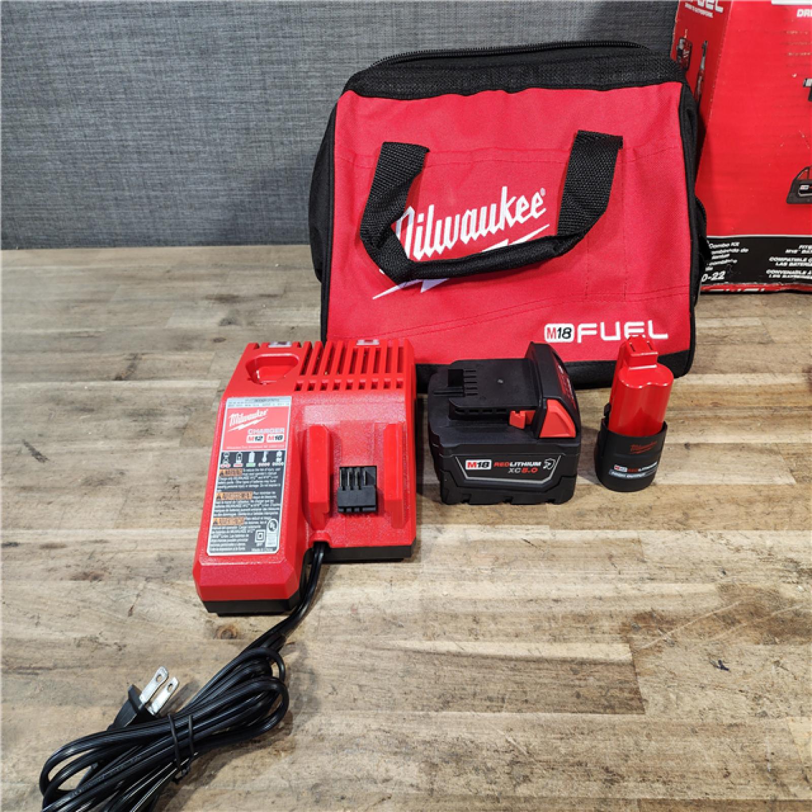 HOUSTON LOCATION - AS-IS Milwaukee FUEL 18V Cordless Mid Torque 1/2 in. Impact Wrench w/ M12 FUEL 3/8 in. Ratchet & Battery/Charger Combo Kit