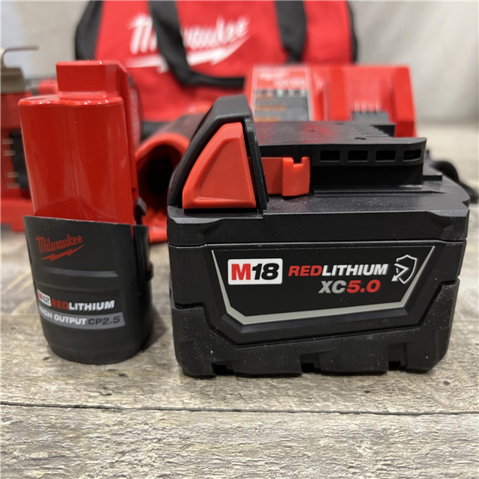 AS-IS Milwaukee FUEL 18V Cordless Mid Torque 1/2 in. Impact Wrench w/ 12 FUEL 3/8 in. Ratchet Combo Kit